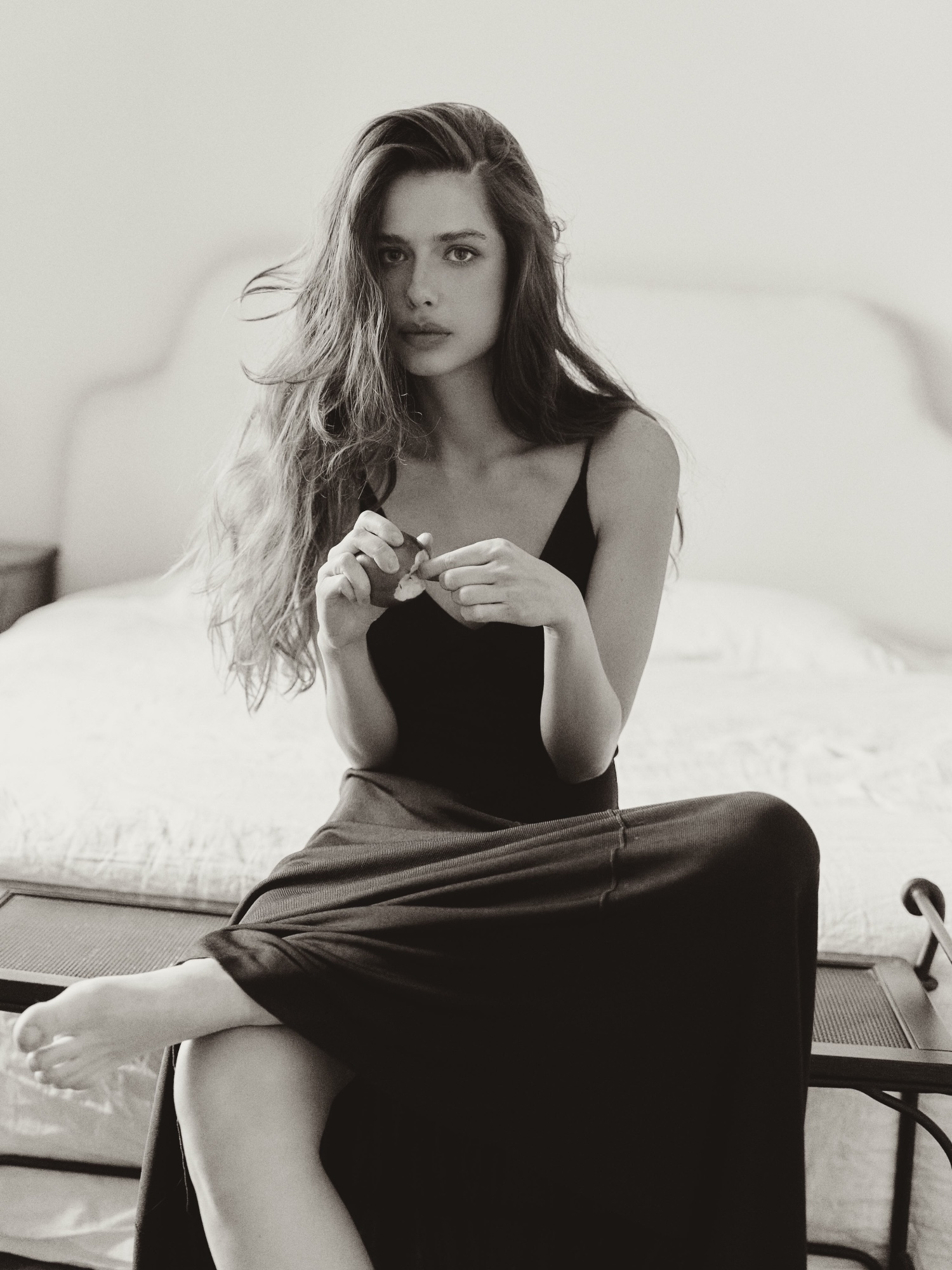 Sofya Breydo in a black dress, intimate editorial.