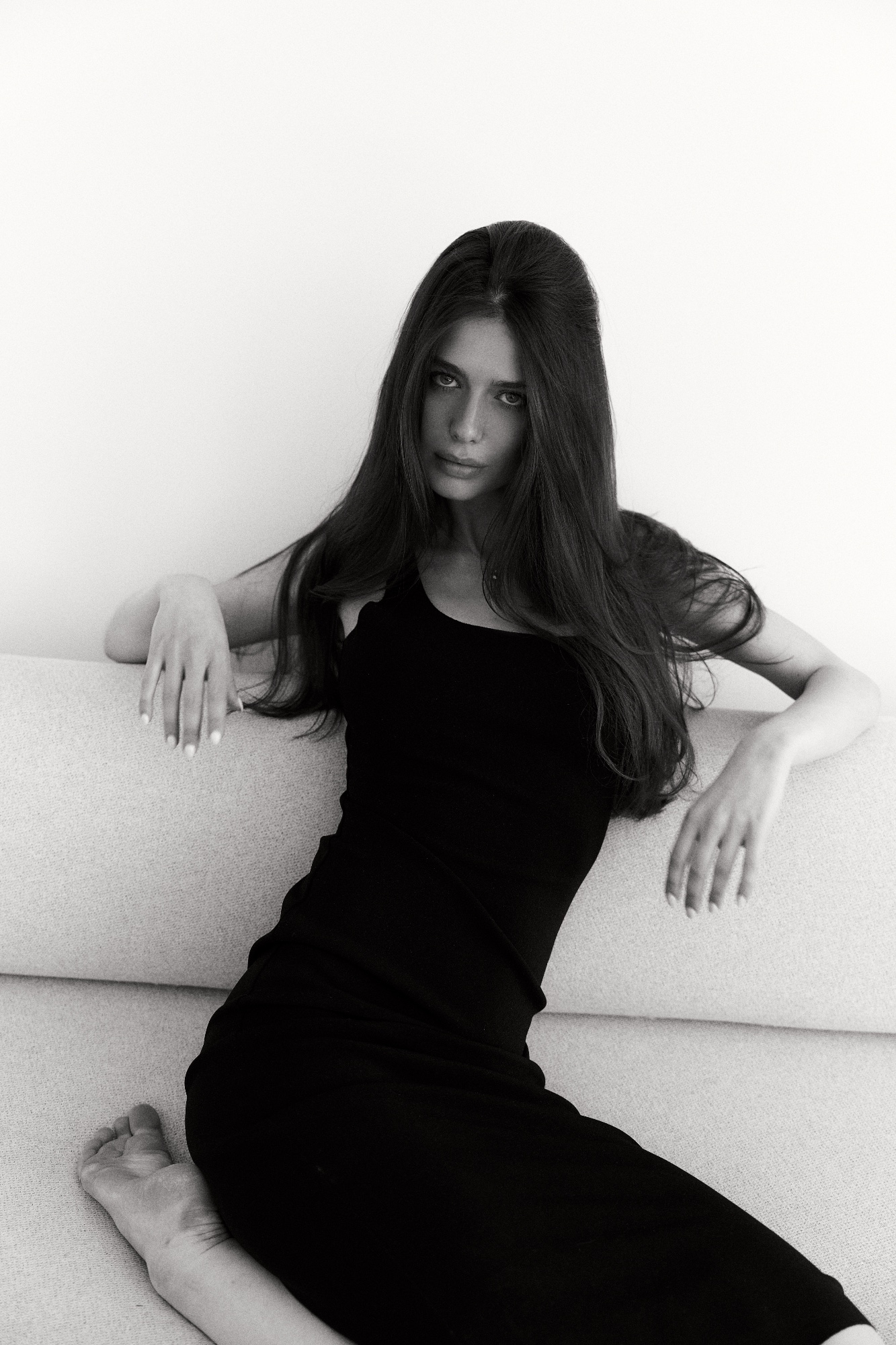 Sofya Breydo in a black dress, studio.